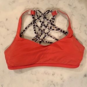 Orange lululemon sports bra.